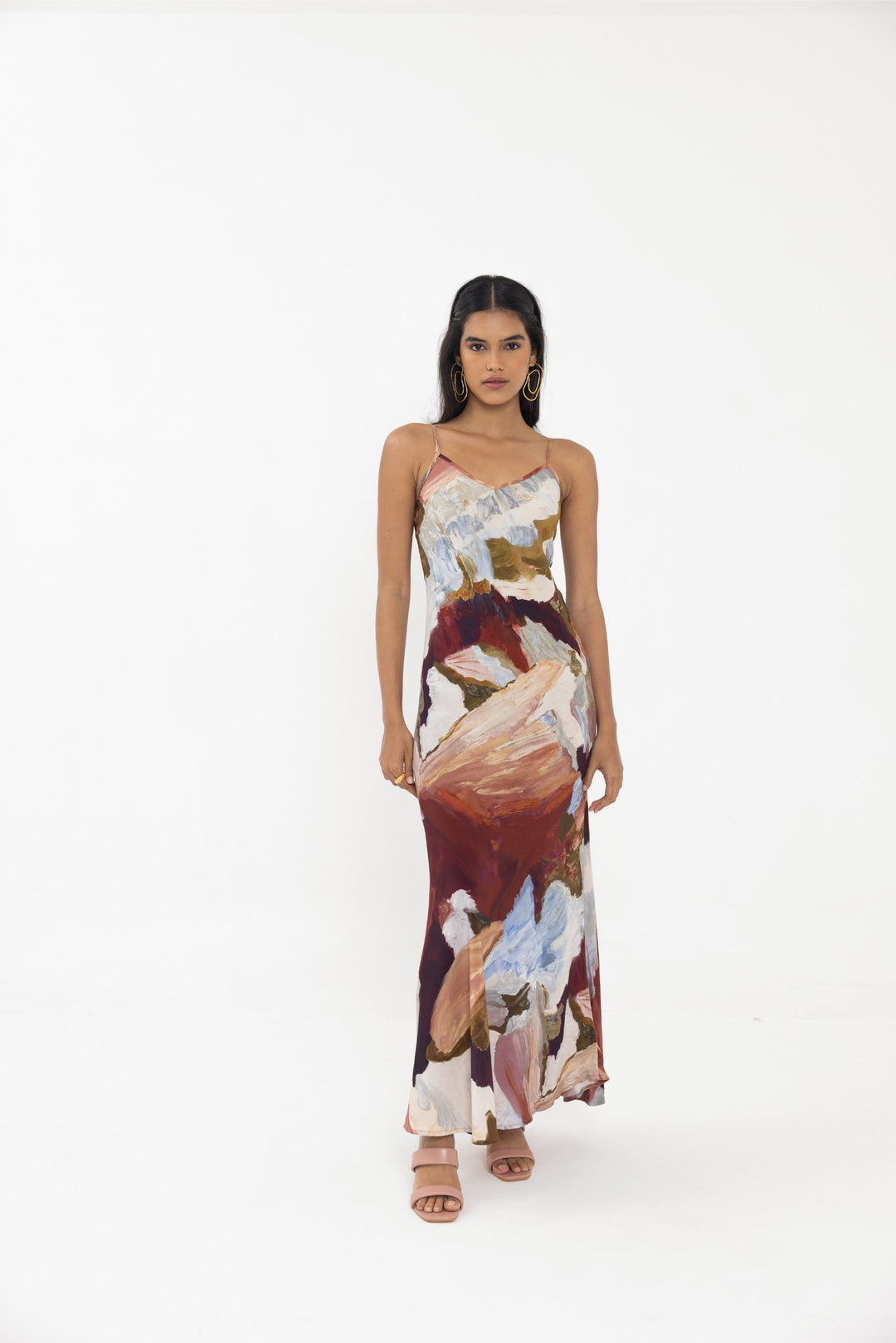 Thr3letter Cadenza Sleeveless Floral Slip Dress - A sleeveless, midi-length dress with a satin finish and a vibrant floral print in shades of pink, orange, and blue.