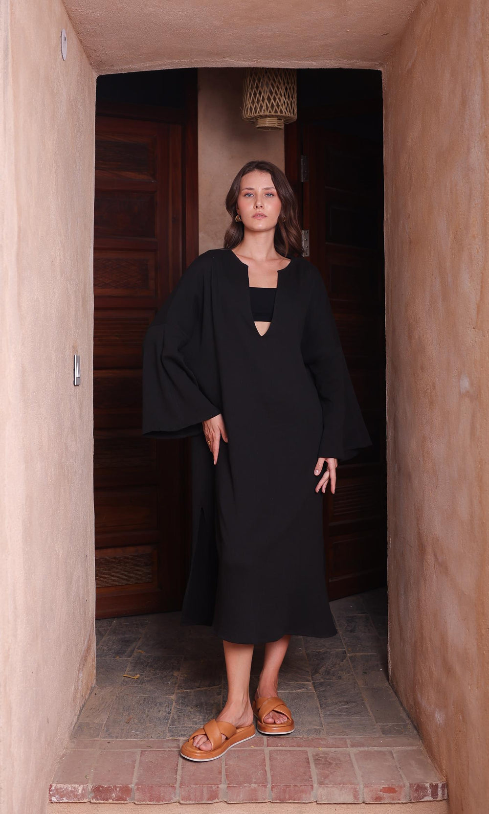 Thr3letter's Kiaan Kaftan in a rich, regal black hue, crafted from a seersucker and cotton blend.