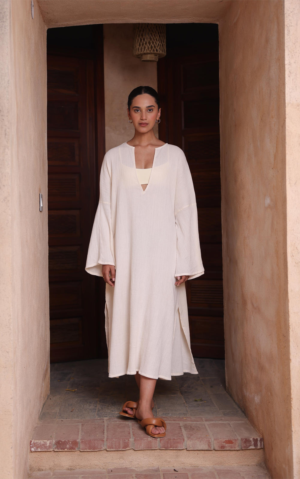The Kiaan Kaftan by Thr3letter, a comfortable design in a warm almond shade made of seersucker and cotton.