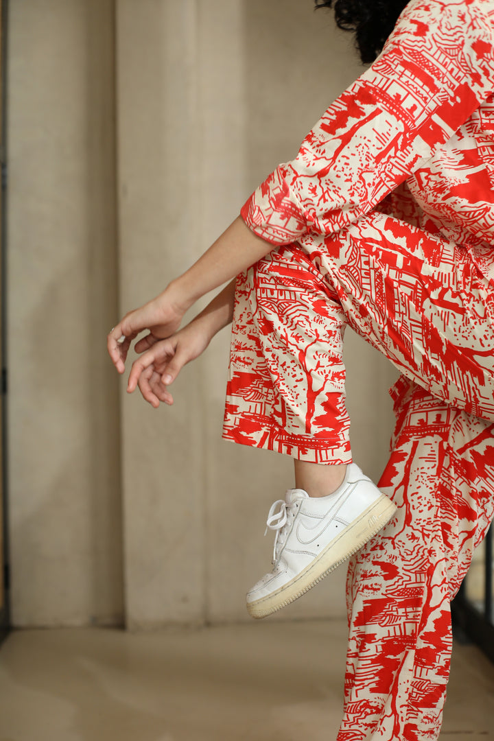 thr3letter's Red Romance Trousers: Statement pants with bold red temple motifs and contemporary street style appeal