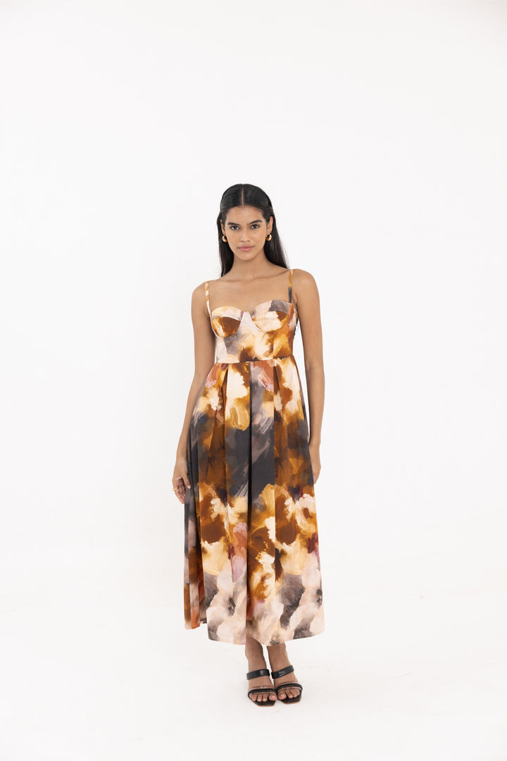 Thr3letter Yafa Padded Dress - A floor-length dress featuring a floral print in shades of orange, white, and brown with a padded bodice and spaghetti straps.