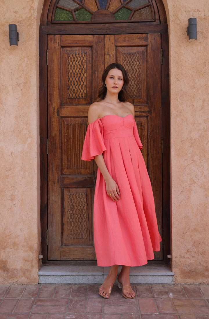 Thr3letter's Seraphina Dress in a warm salmon hue, a stunning choice for any occasion.