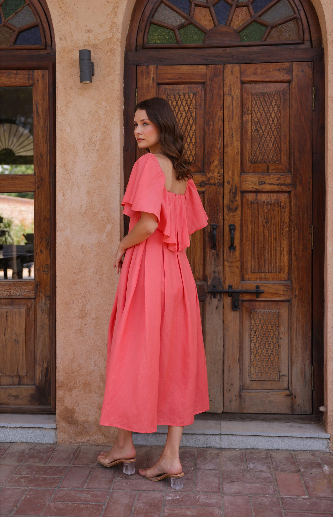 The Seraphina Dress by Thr3letter, with its sweetheart neckline and flutter sleeves, exudes timeless sophistication.