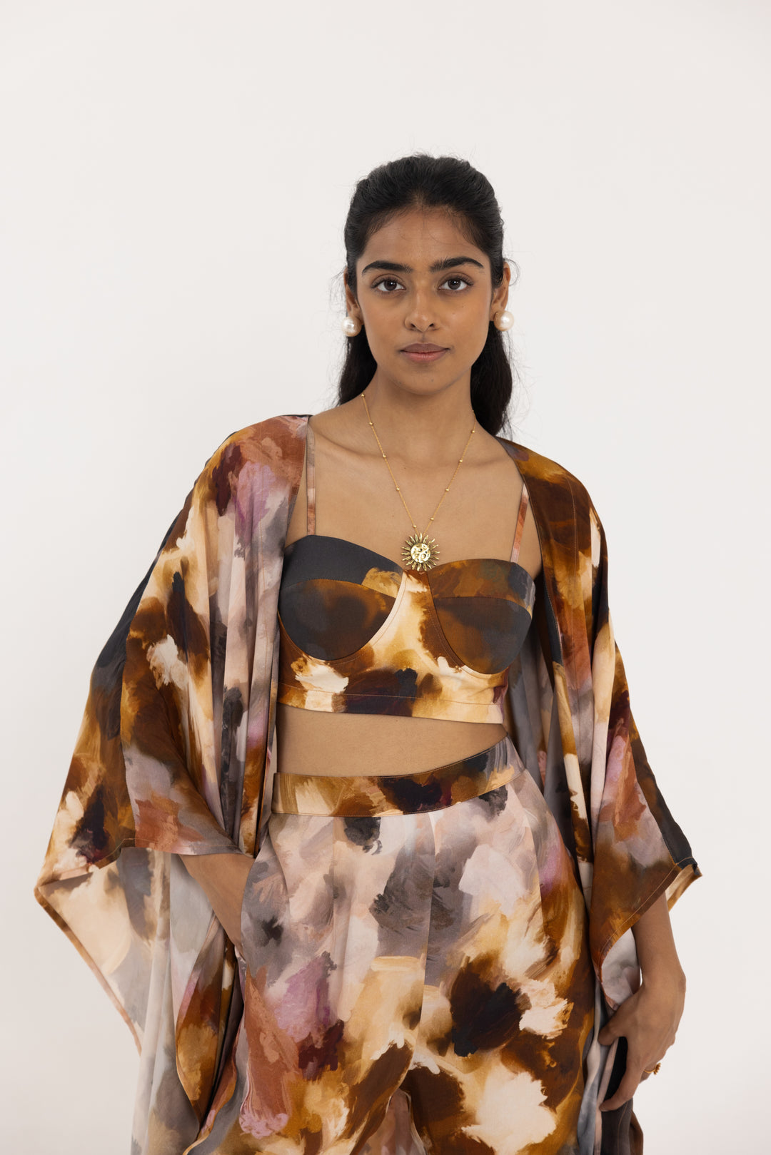 Flowing Thr3letter luxury dress in abstract earth tones, made from 100% crepe with contemporary print design