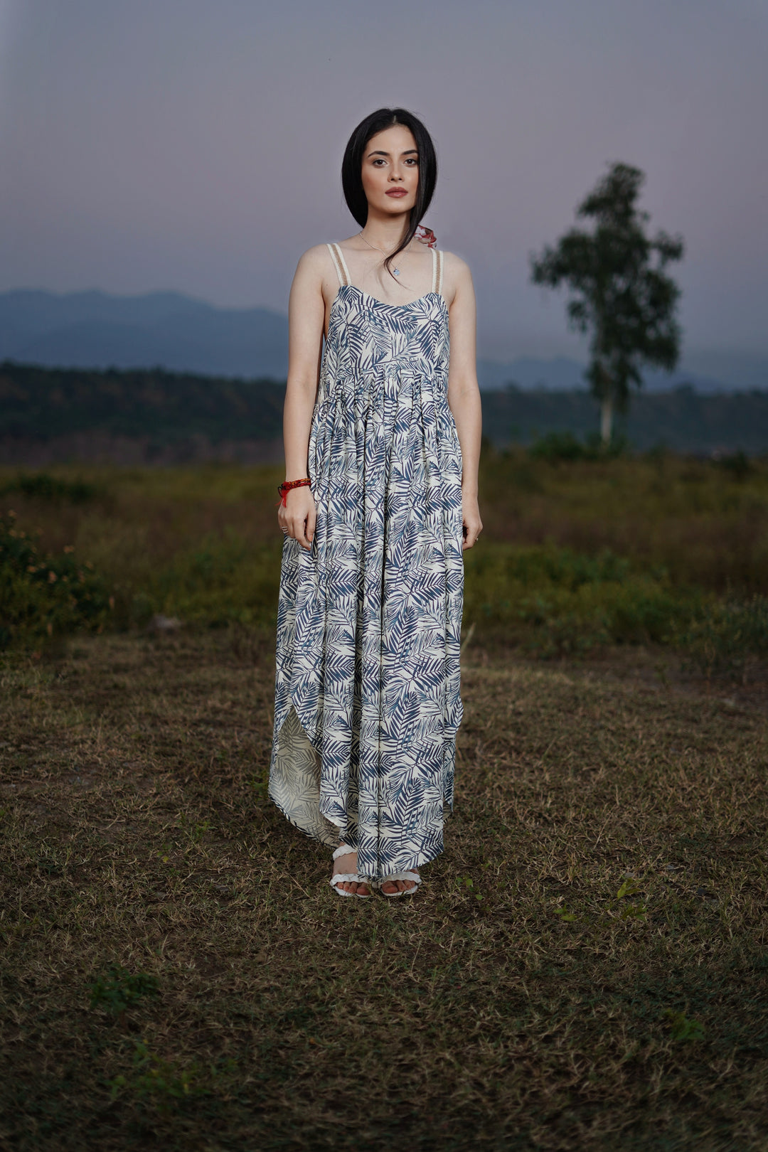 thr3letter's signature bohemian jumpsuit with double strap details and palm frond motif